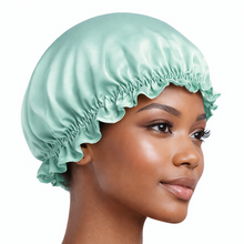 Load image into Gallery viewer, Blue 100% mulberry silk bonnet with soft ruffle edge, worn as a silk sleeping cap for smooth, protected hair